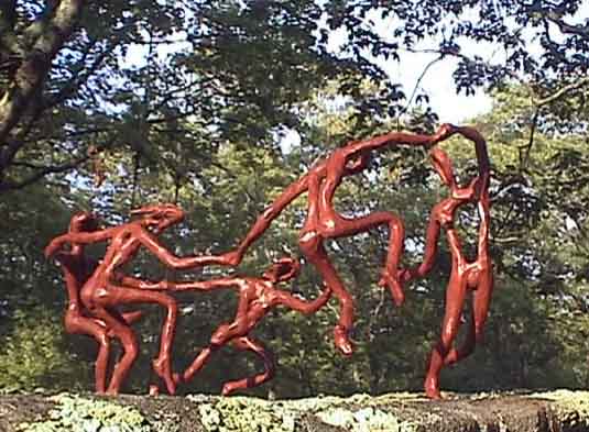 The Dance II #1 playing on a rock at the Wild Island Sculpture Garden in Chilmark