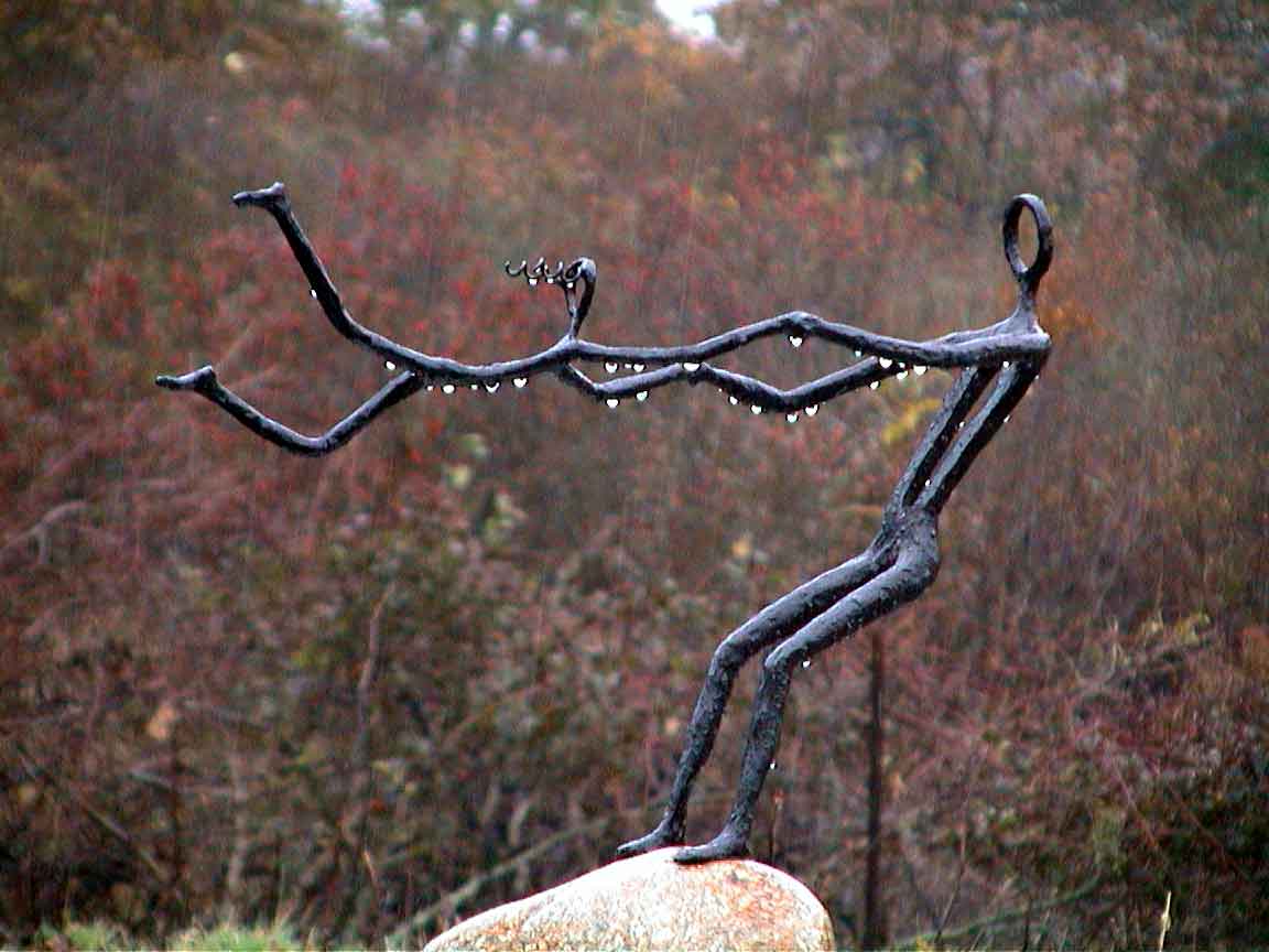 Swing Jenny bronze sculpture in the Fall rain - by Jay Lagemann